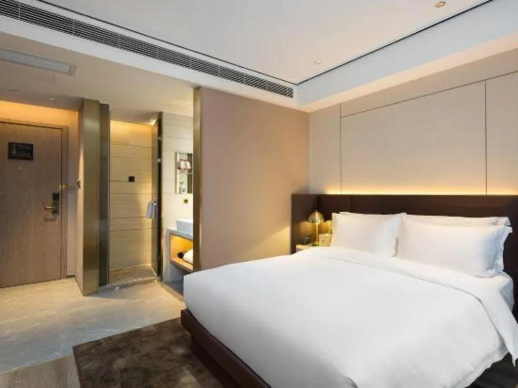 Bed in Echarm Plus Hotel Changsha High-speed Railway South Station Desiqin