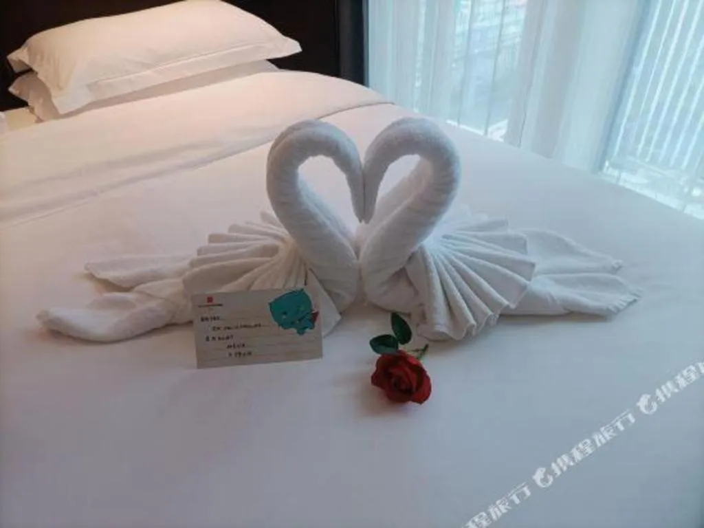 Bed in Echarm Plus Hotel Changsha High-speed Railway South Station Desiqin