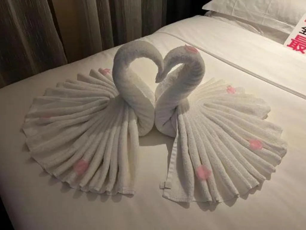 Bed in Echarm Plus Hotel Changsha High-speed Railway South Station Desiqin