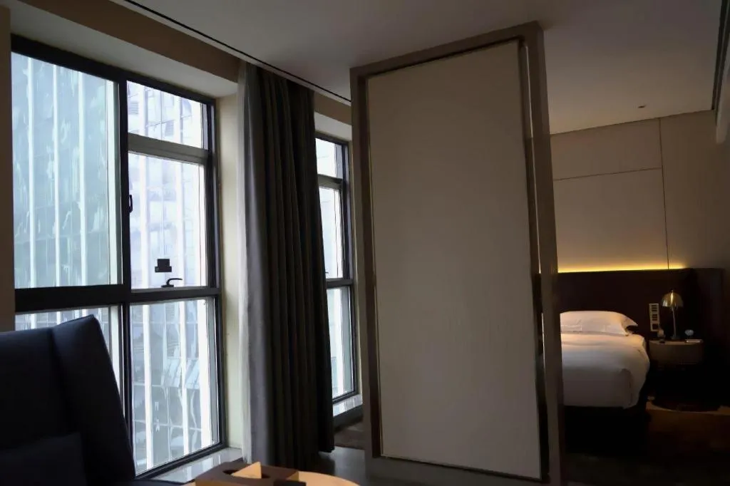 Bed in Echarm Plus Hotel Changsha High-speed Railway South Station Desiqin