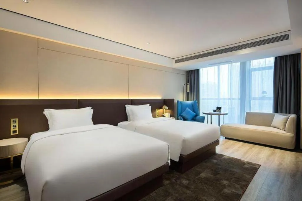 Bed in Echarm Plus Hotel Changsha High-speed Railway South Station Desiqin