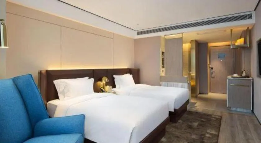 Bed in Echarm Plus Hotel Changsha High-speed Railway South Station Desiqin