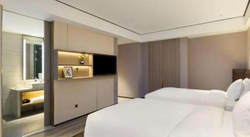 Bed in Echarm Plus Hotel Changsha High-speed Railway South Station Desiqin