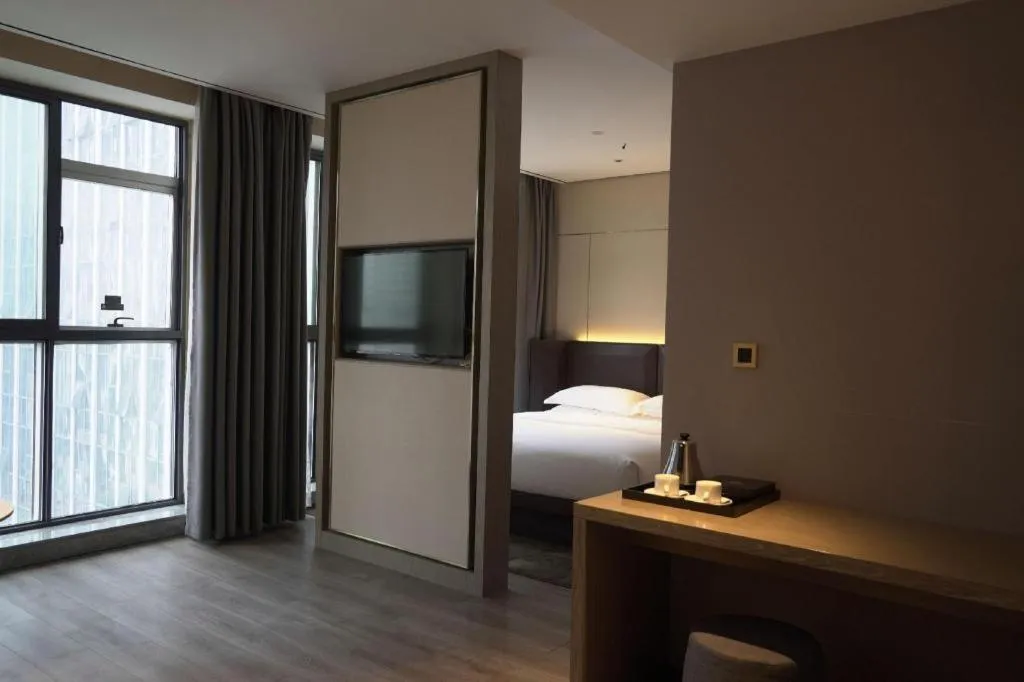 Bed in Echarm Plus Hotel Changsha High-speed Railway South Station Desiqin