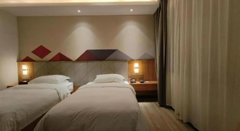 Bed in Borrman Hotel Jingzhou Jiangjin West Road Wanda Plaza Fantawild