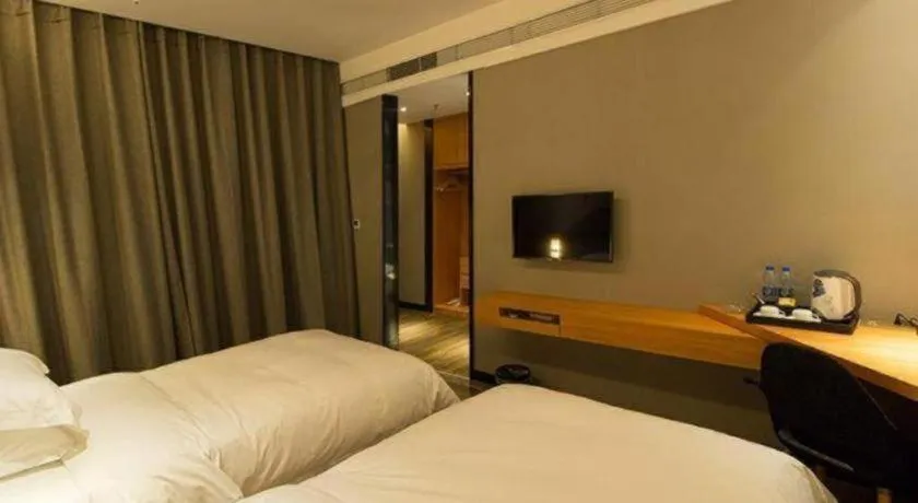 Bed in Borrman Hotel Jingzhou Jiangjin West Road Wanda Plaza Fantawild