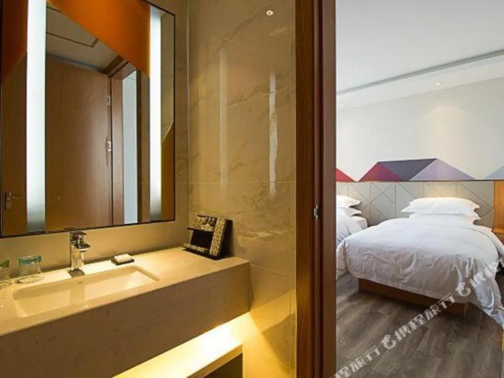 Bed in Borrman Hotel Jingzhou Jiangjin West Road Wanda Plaza Fantawild