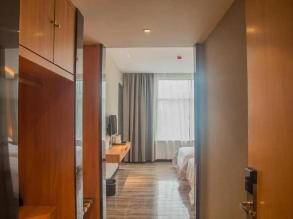 Bed in Borrman Hotel Jingzhou Jiangjin West Road Wanda Plaza Fantawild