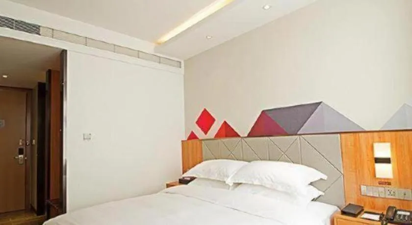 Bed in Borrman Hotel Jingzhou Jiangjin West Road Wanda Plaza Fantawild
