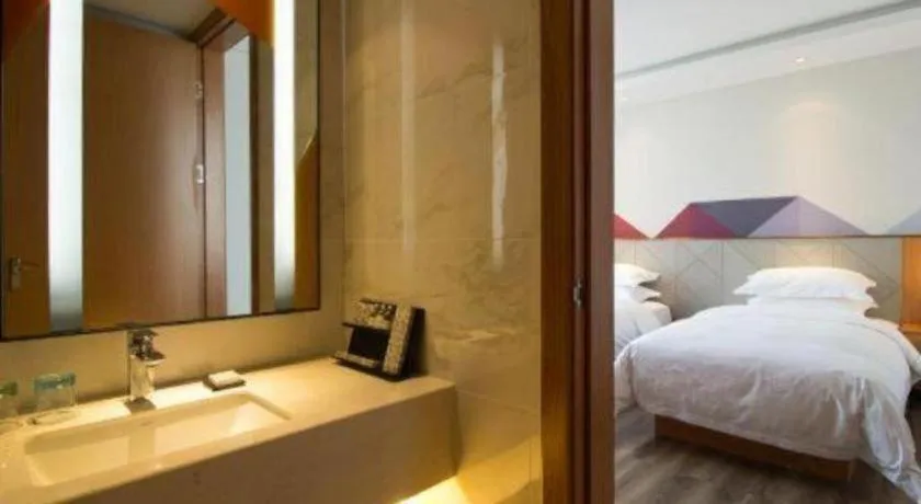 Bed in Borrman Hotel Jingzhou Jiangjin West Road Wanda Plaza Fantawild