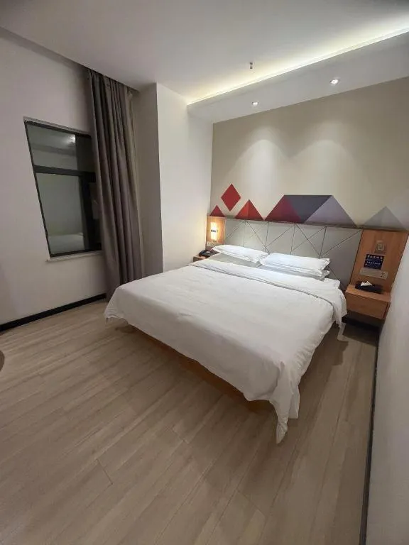 Bed in Borrman Hotel Jingzhou Jiangjin West Road Wanda Plaza Fantawild