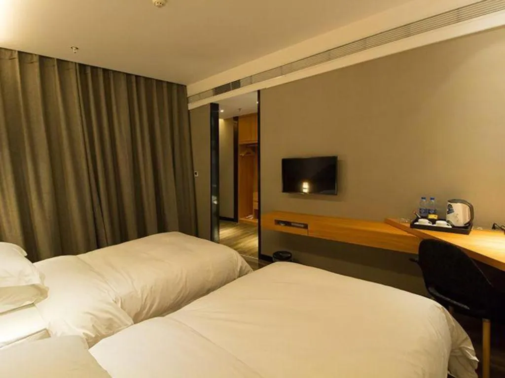 Bed in Borrman Hotel Jingzhou Jiangjin West Road Wanda Plaza Fantawild