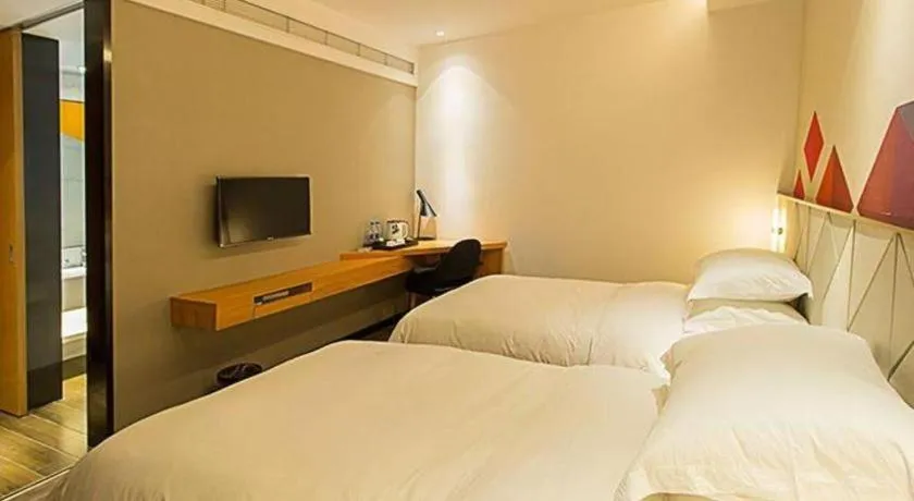 Bed in Borrman Hotel Jingzhou Jiangjin West Road Wanda Plaza Fantawild