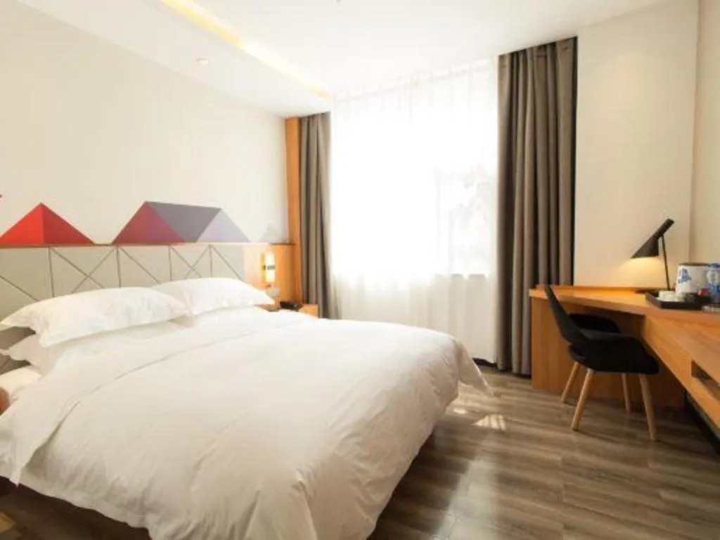 Bed in Borrman Hotel Jingzhou Jiangjin West Road Wanda Plaza Fantawild