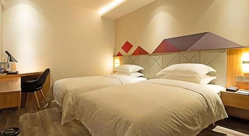 Bed in Borrman Hotel Jingzhou Jiangjin West Road Wanda Plaza Fantawild