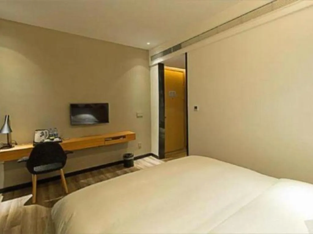 Bed in Borrman Hotel Jingzhou Jiangjin West Road Wanda Plaza Fantawild