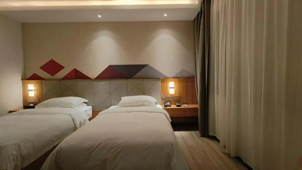 Bed in Borrman Hotel Jingzhou Jiangjin West Road Wanda Plaza Fantawild