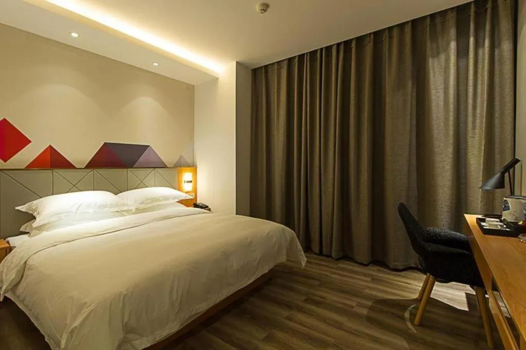 Bed in Borrman Hotel Jingzhou Jiangjin West Road Wanda Plaza Fantawild