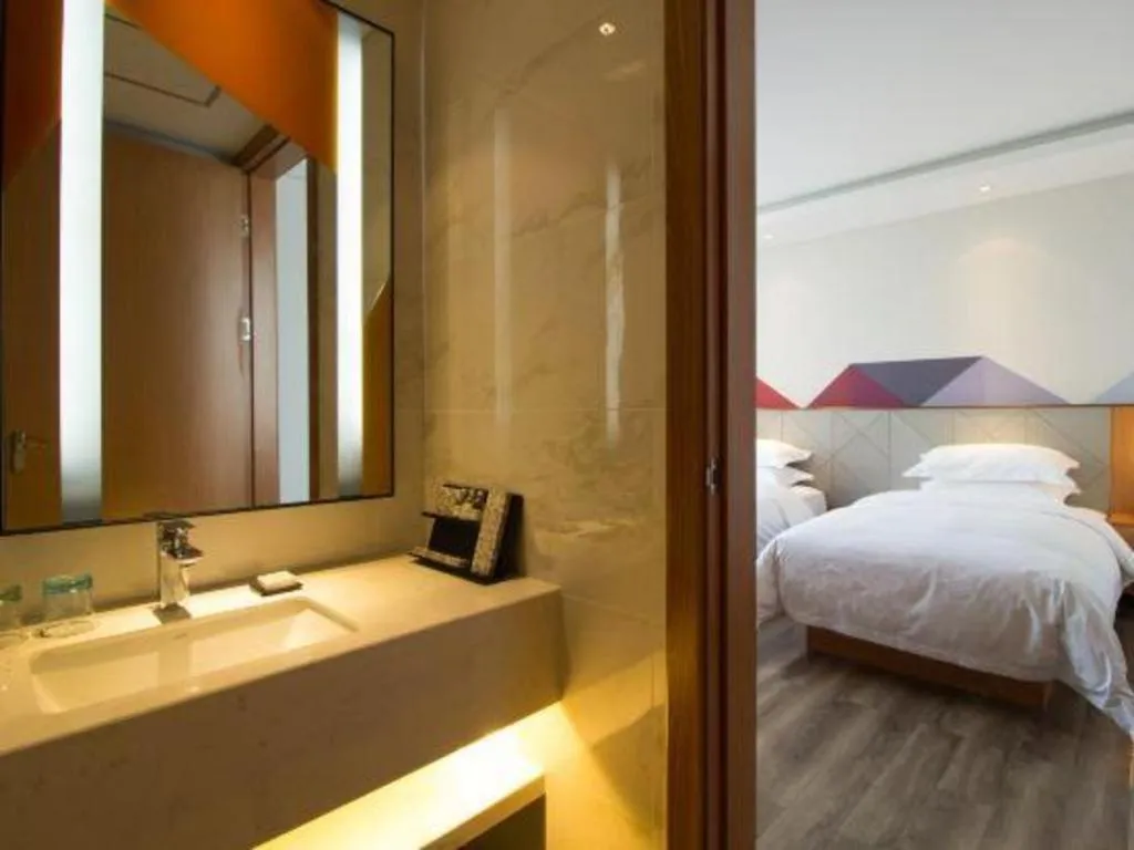 Bed in Borrman Hotel Jingzhou Jiangjin West Road Wanda Plaza Fantawild