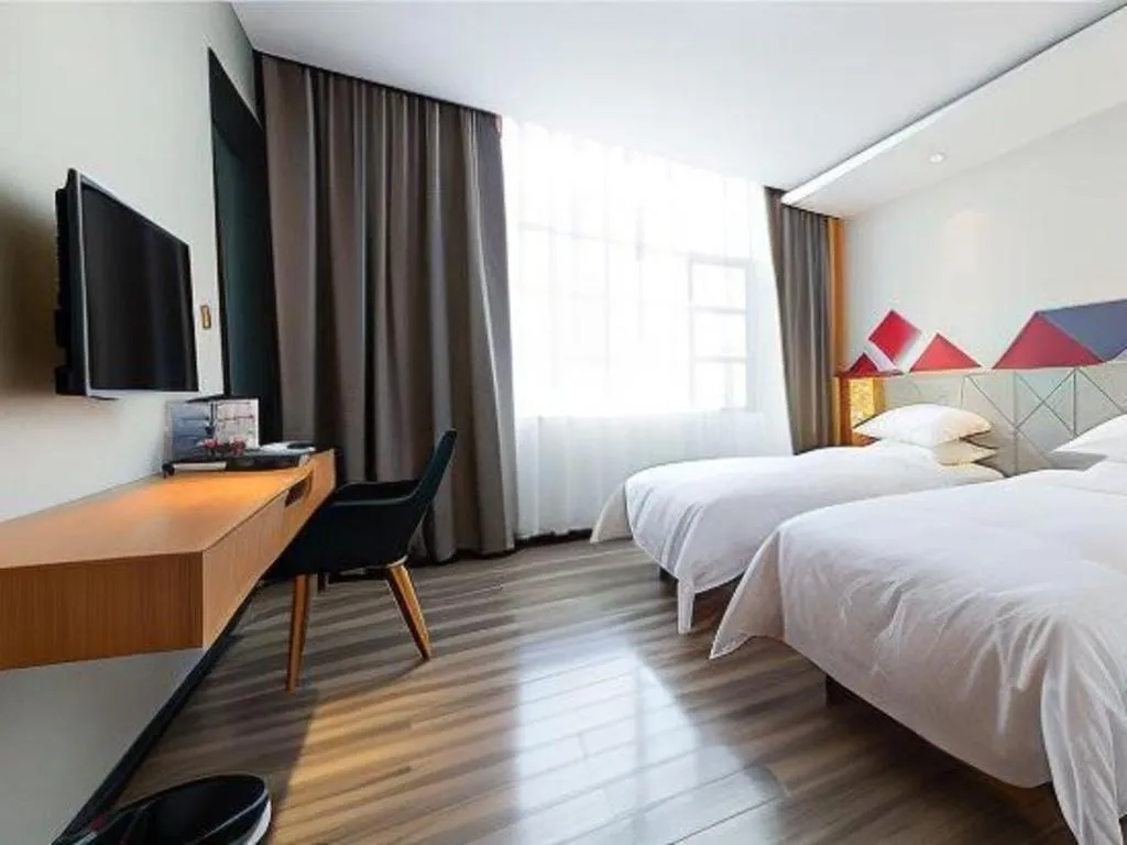 Bed in Borrman Hotel Jingzhou Jiangjin West Road Wanda Plaza Fantawild