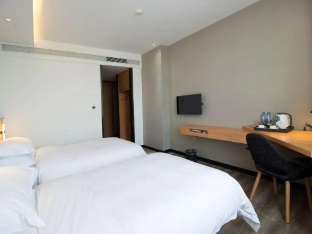 Bed in Borrman Hotel Jingzhou Jiangjin West Road Wanda Plaza Fantawild