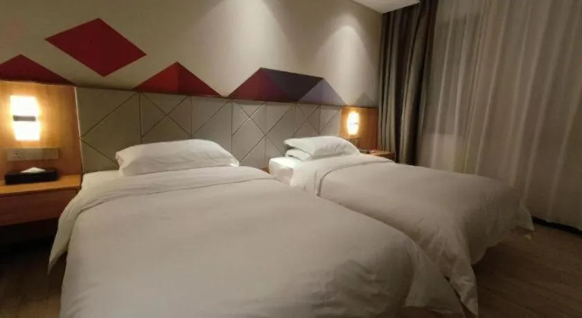 Bed in Borrman Hotel Jingzhou Jiangjin West Road Wanda Plaza Fantawild