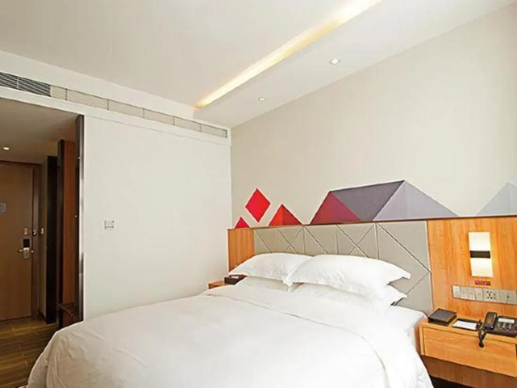 Bed in Borrman Hotel Jingzhou Jiangjin West Road Wanda Plaza Fantawild