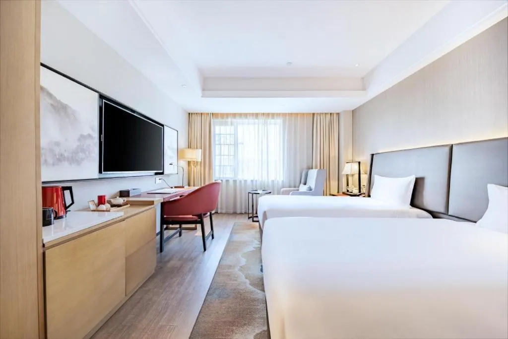 Bed in Echeng Hotel Changsha Evening News