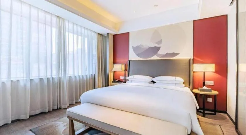 Bed in Echeng Hotel Changsha Evening News