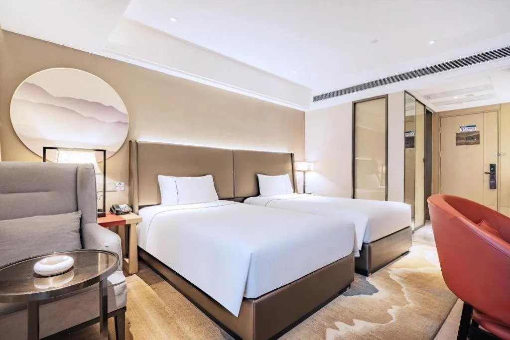 Bed in Echeng Hotel Changsha Evening News