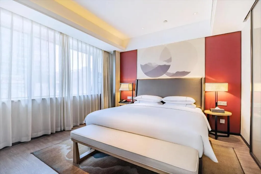 Bed in Echeng Hotel Changsha Evening News