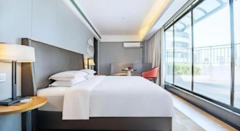 Bed in Echeng Hotel Changsha Evening News