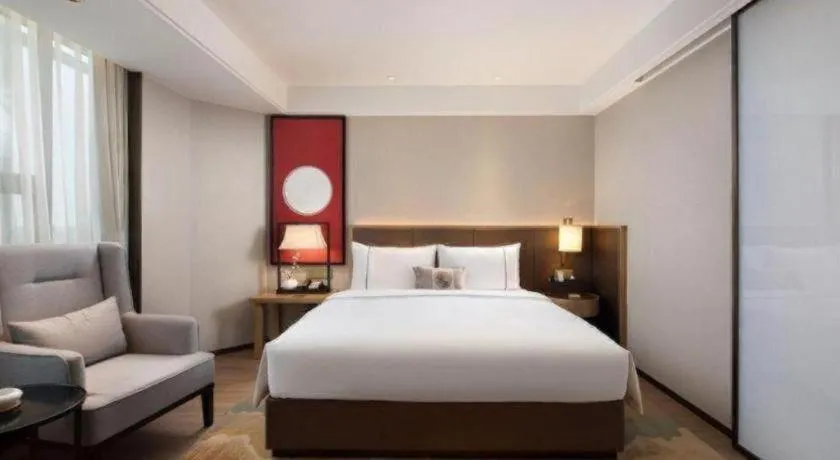 Bed in Echeng Hotel Changsha Evening News