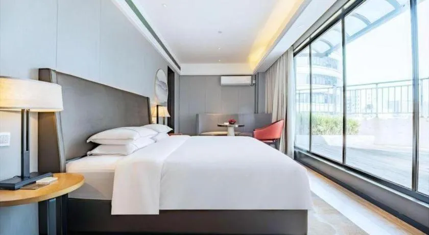 Bed in Echeng Hotel Changsha Evening News