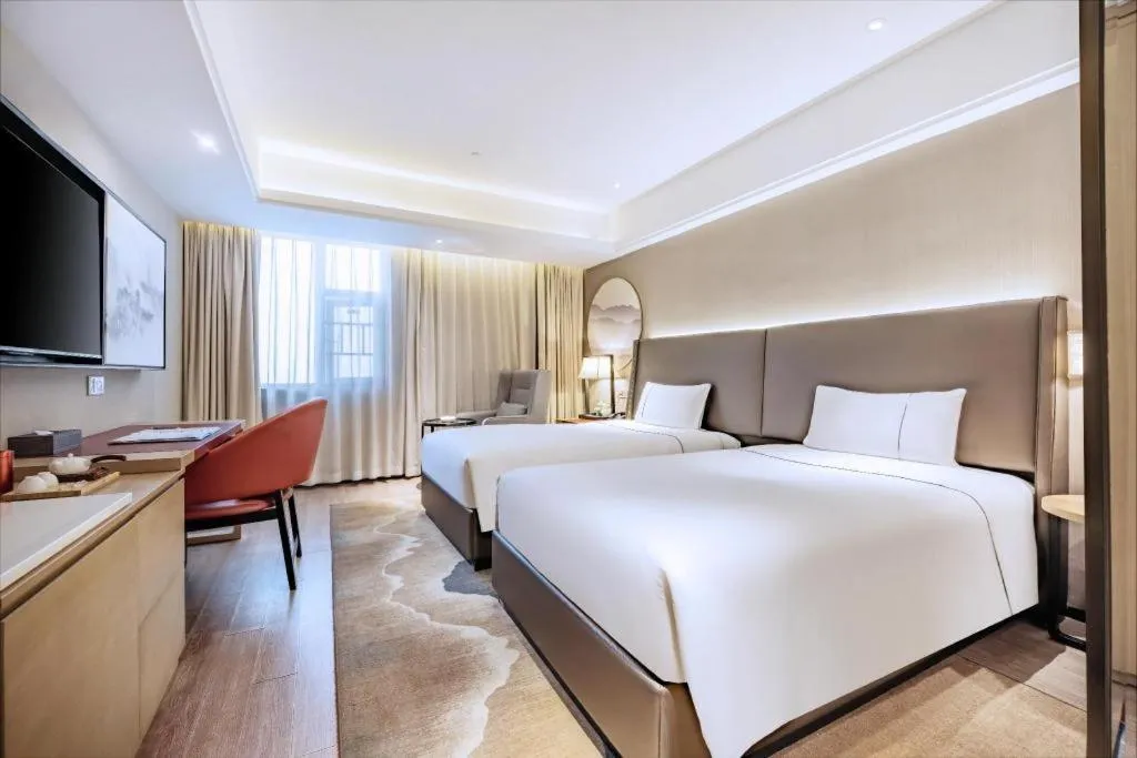 Bed in Echeng Hotel Changsha Evening News