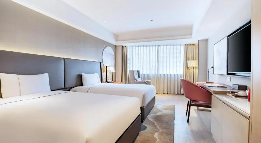 Bed in Echeng Hotel Changsha Evening News