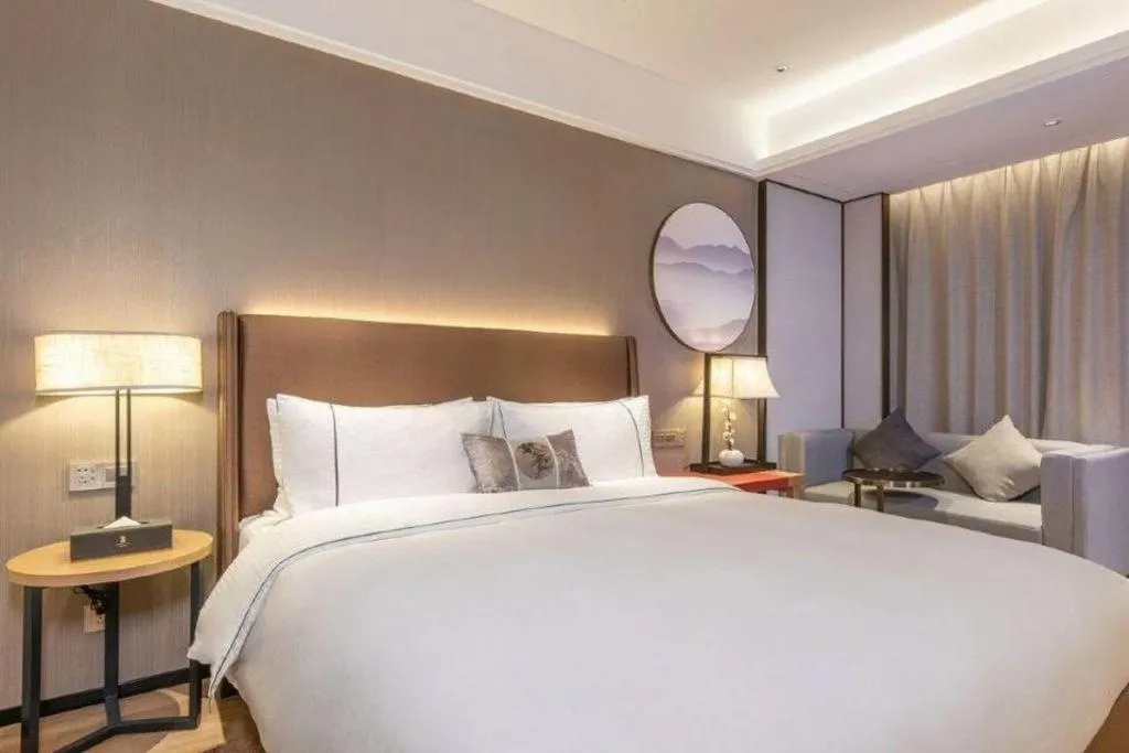 Bed in Echeng Hotel Changsha Evening News