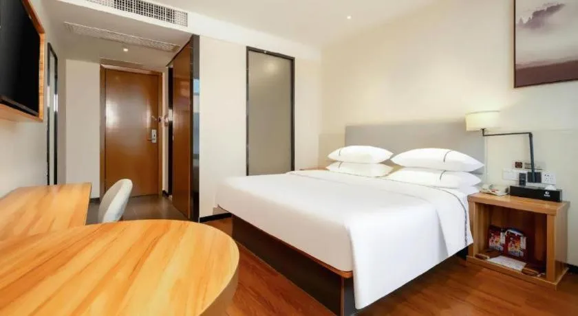 Bed in JTOUR Inn Hechi Yizhou Municipal Central Plaza