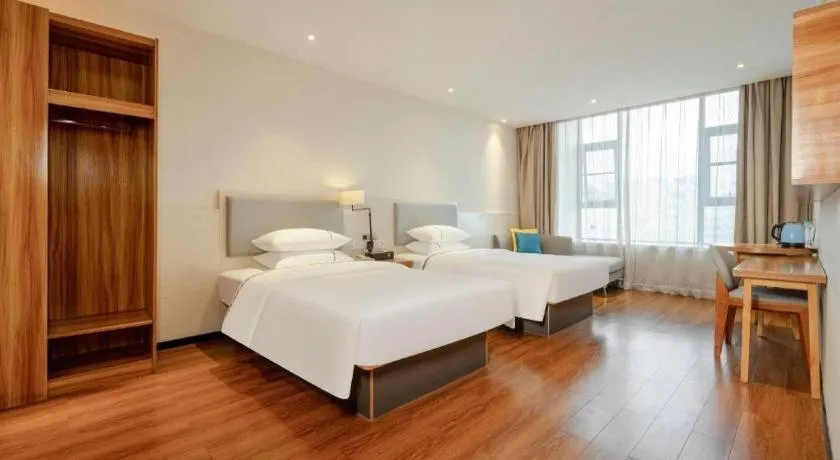 Bed in JTOUR Inn Hechi Yizhou Municipal Central Plaza