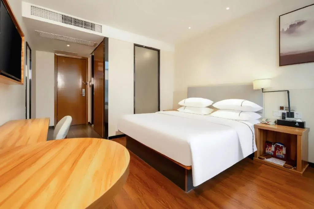 Bed in JTOUR Inn Hechi Yizhou Municipal Central Plaza