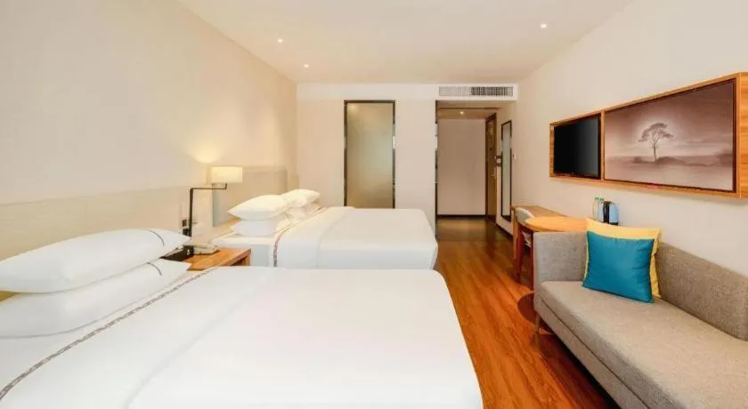 Bed in JTOUR Inn Hechi Yizhou Municipal Central Plaza