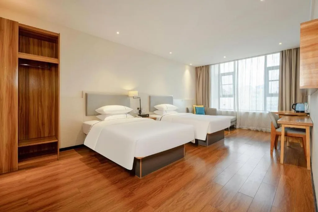 Bed in JTOUR Inn Hechi Yizhou Municipal Central Plaza
