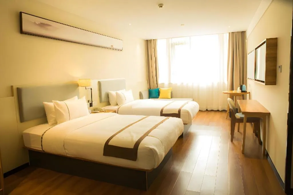 Bed in JTOUR Inn Hechi Yizhou Municipal Central Plaza