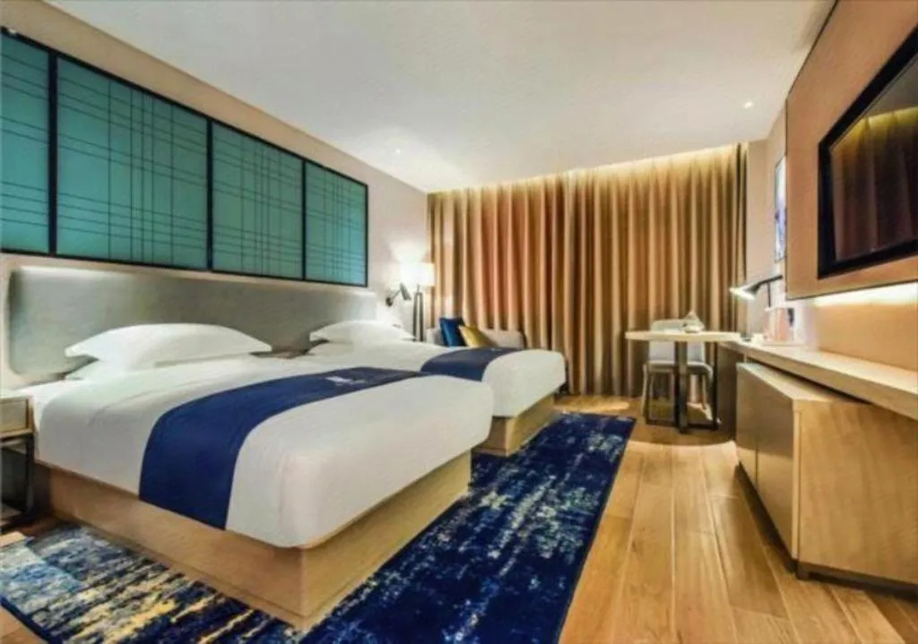Bed in Echarm Hotel Anshun High-speed Railway Station Jichang Road