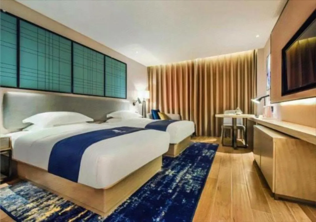 Bed in Echarm Hotel Anshun High-speed Railway Station Jichang Road
