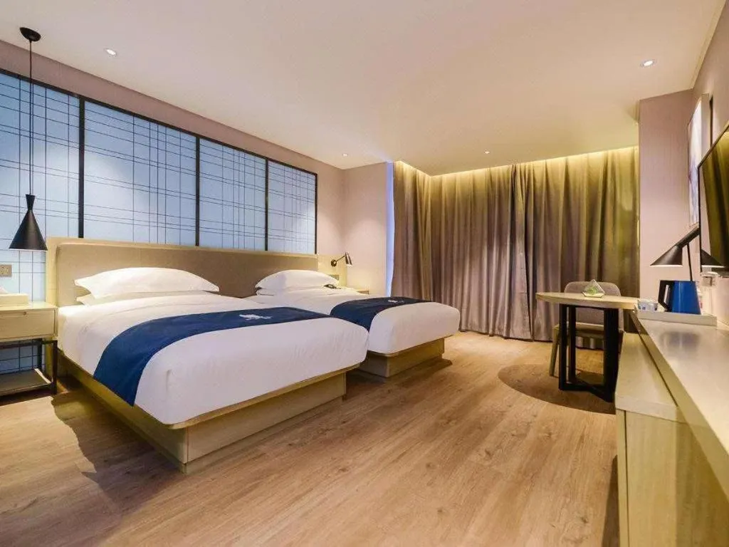 Bed in Echarm Hotel Anshun High-speed Railway Station Jichang Road