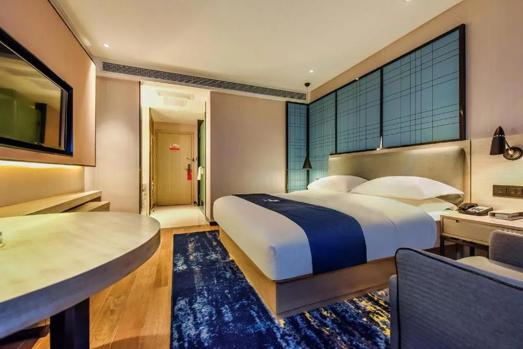Bed in Echarm Hotel Anshun High-speed Railway Station Jichang Road