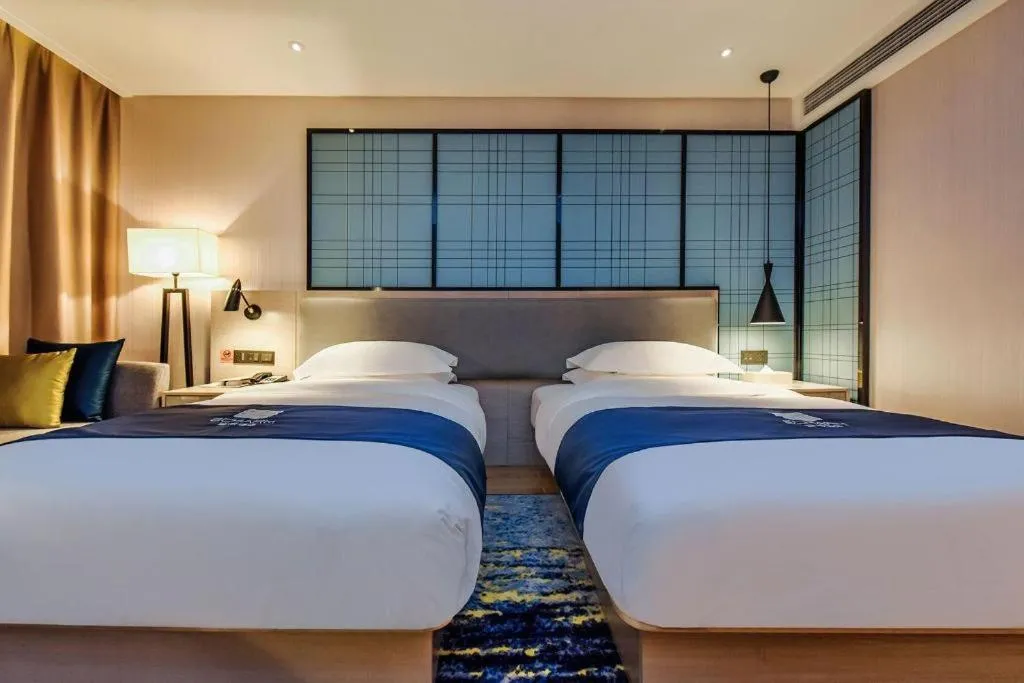 Bed in Echarm Hotel Anshun High-speed Railway Station Jichang Road