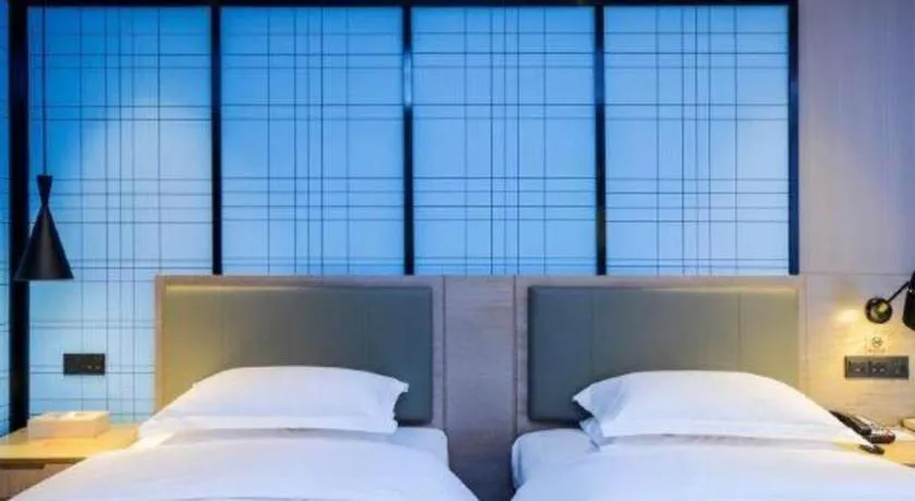 Bed in Echarm Hotel Anshun High-speed Railway Station Jichang Road