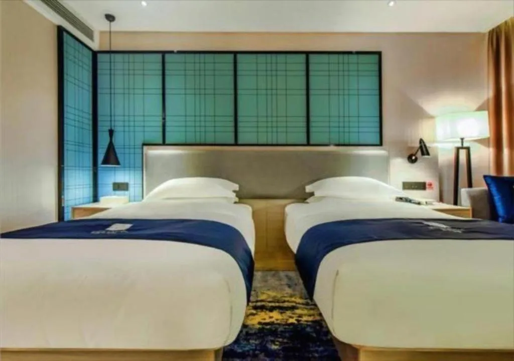 Bed in Echarm Hotel Anshun High-speed Railway Station Jichang Road